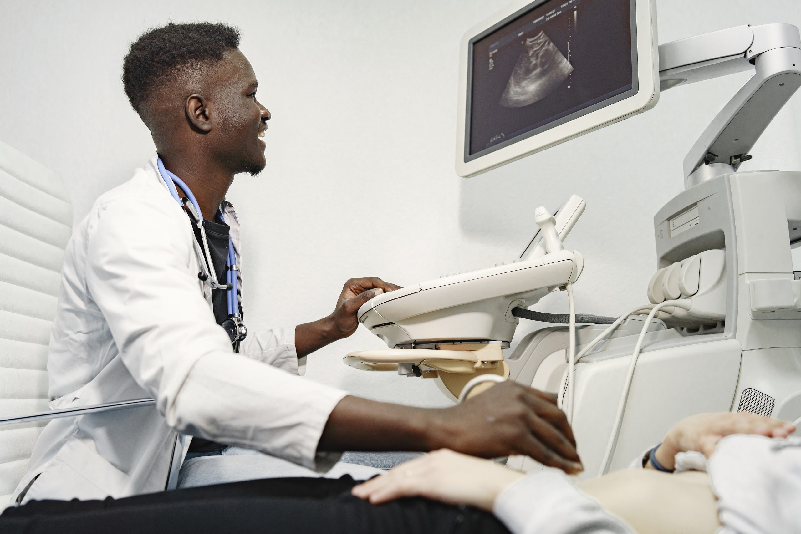 an african doctor makes an ultrasound diagnosis